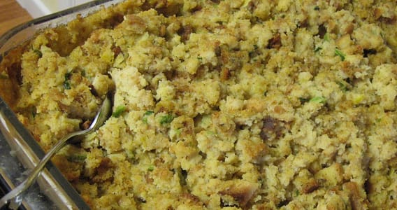 Step-by-step image guide on making herb-infused cornbread dressing, showcasing the golden-baked cornbread, fresh herbs, and the final delicious dressing ready to be served.